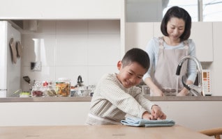 Boy Wiping Table by Duster